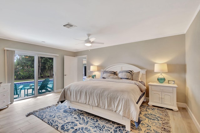 bedroom with baseboards, light wood-style flooring, visible vents, and access to exterior