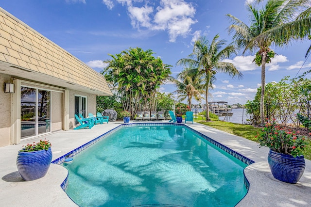 view of pool featuring a patio and a fenced in pool