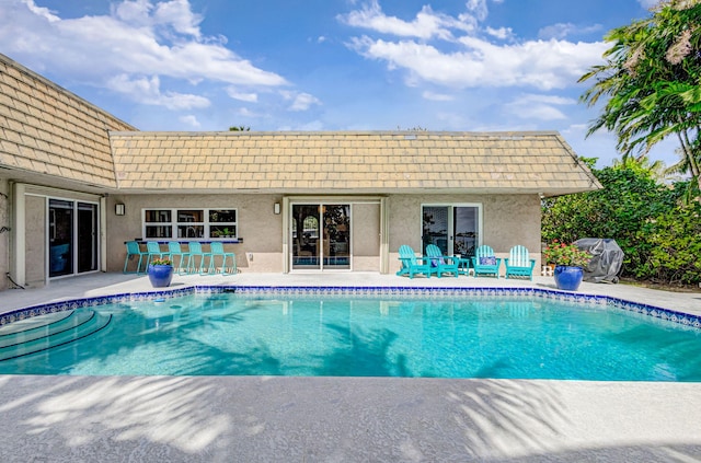 outdoor pool featuring a patio