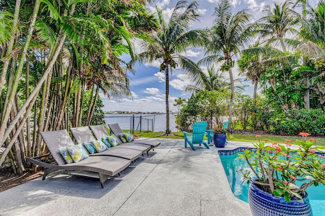 view of patio / terrace featuring fence and a fenced in pool