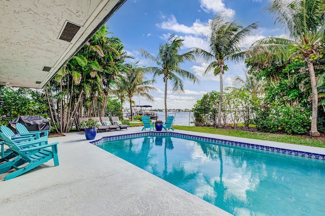 view of pool with fence, a fenced in pool, and a patio