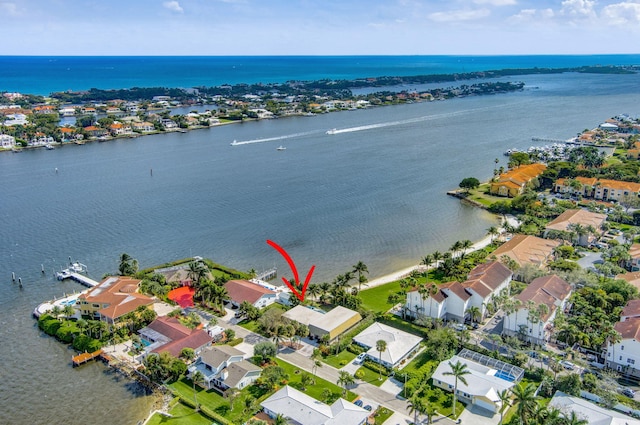 bird's eye view featuring a residential view and a water view