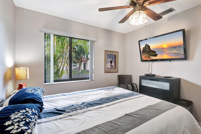 bedroom with ceiling fan and visible vents