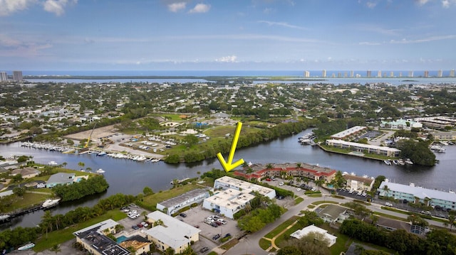 drone / aerial view with a view of city and a water view