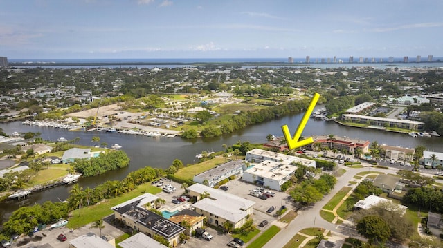 bird's eye view featuring a water view and a city view