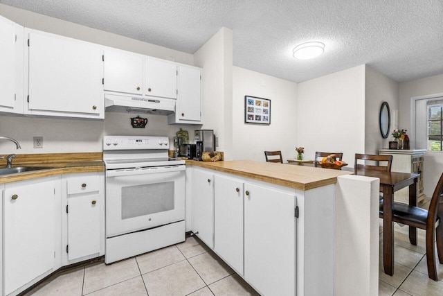 kitchen featuring under cabinet range hood, white cabinetry, and white electric range