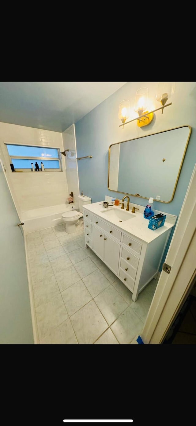 full bathroom featuring toilet, tile patterned flooring, shower / bathing tub combination, and vanity