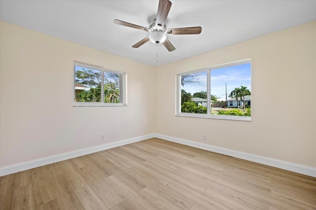 514 Jaeger Dr, Delray Beach, FL 33444 - spare room featuring light wood-type flooring, baseboards, healthy amount of natural light, and ceiling fan