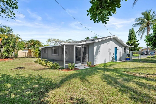 514 Jaeger Dr, Delray Beach, FL 33444 - rear view of property with a sunroom, a gate, and stucco siding