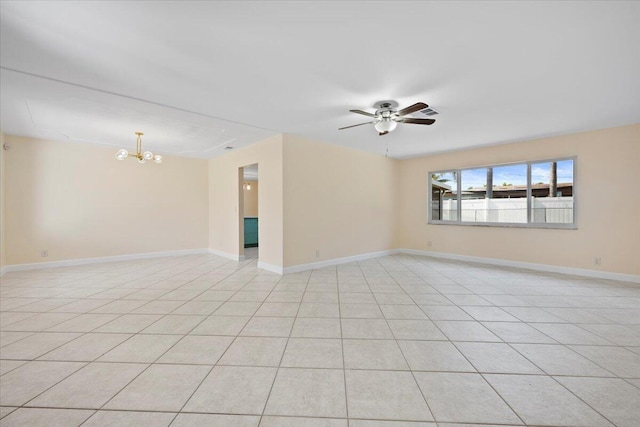 514 Jaeger Dr, Delray Beach, FL 33444 - unfurnished room featuring a chandelier, ceiling fan, light tile patterned floors, and baseboards