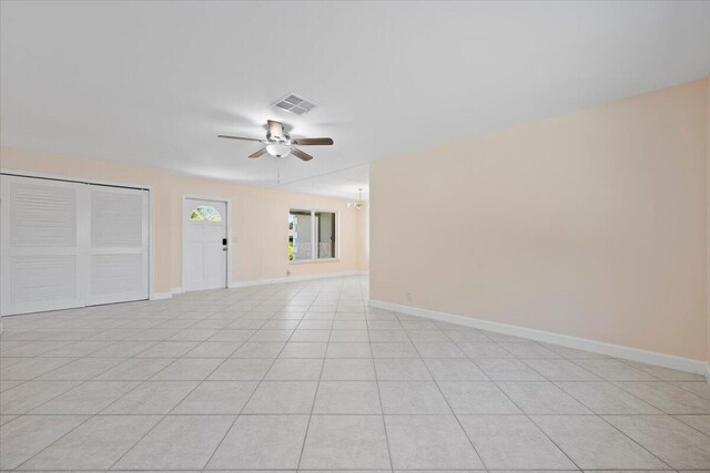 514 Jaeger Dr, Delray Beach, FL 33444 - empty room featuring a ceiling fan, baseboards, and light tile patterned floors