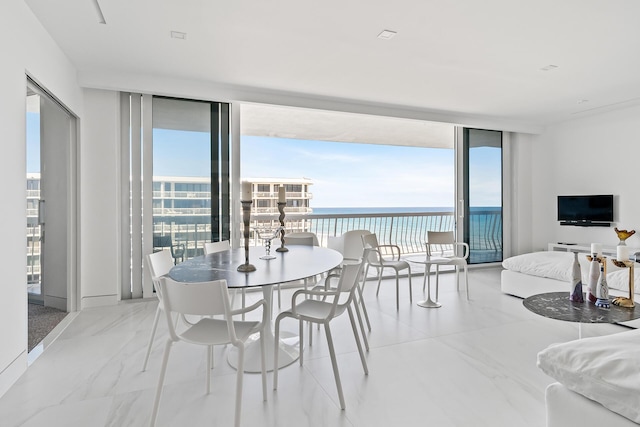 dining room with floor to ceiling windows