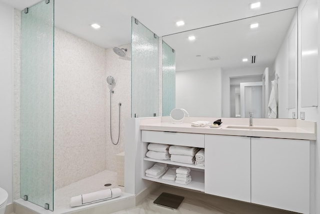 full bath featuring toilet, recessed lighting, vanity, visible vents, and a stall shower