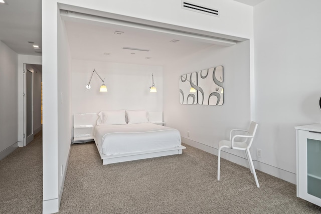 bedroom with carpet floors, baseboards, and visible vents