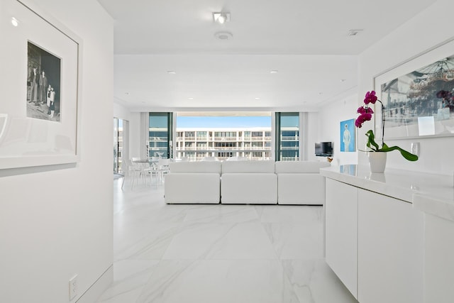 unfurnished living room with marble finish floor