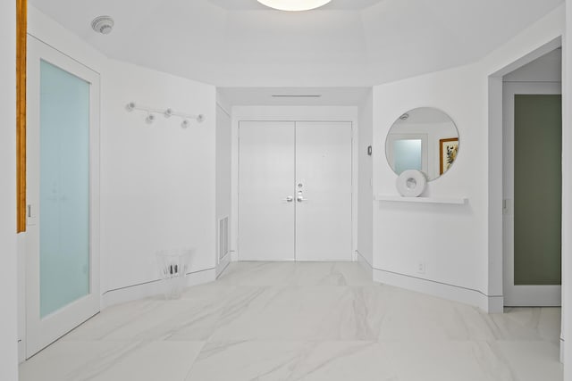 interior space with marble finish floor and visible vents