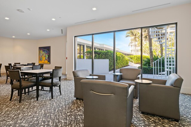 dining area featuring carpet floors, baseboards, and recessed lighting