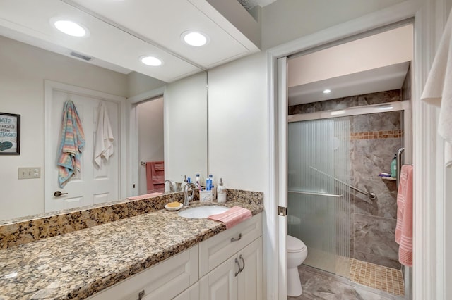 full bathroom with toilet, recessed lighting, visible vents, vanity, and a stall shower