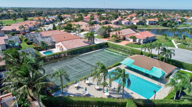 drone / aerial view featuring a water view and a residential view