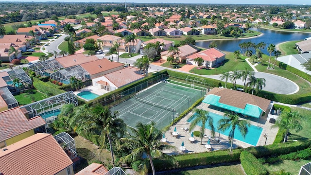 bird's eye view with a water view and a residential view