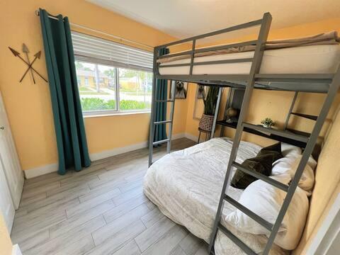 bedroom featuring wood finished floors and baseboards