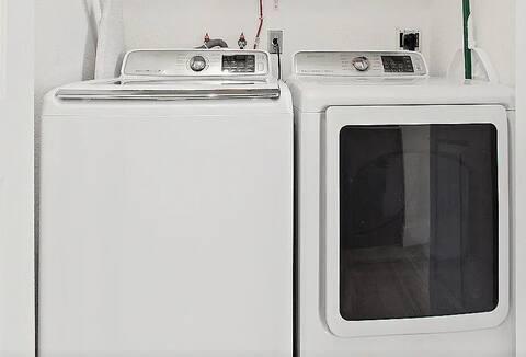 laundry area featuring laundry area and washer and clothes dryer