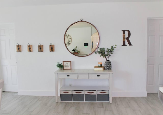 details featuring baseboards and wood finished floors