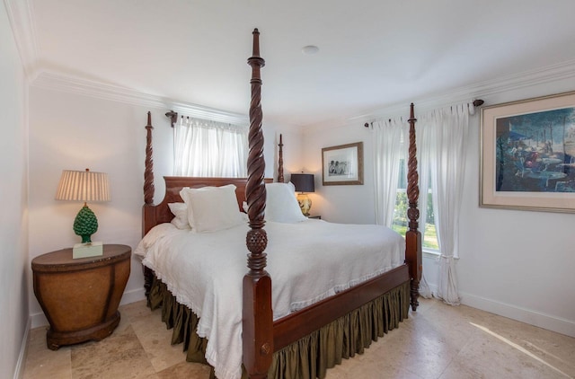 bedroom featuring baseboards, multiple windows, and crown molding