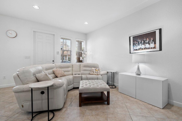 living area with recessed lighting, light tile patterned flooring, and baseboards