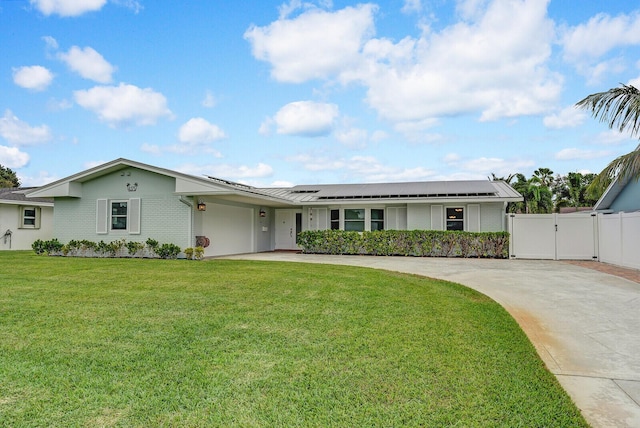 ranch-style home with brick siding, fence, driveway, a gate, and a front yard