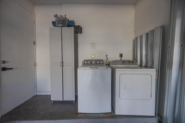 washroom with independent washer and dryer