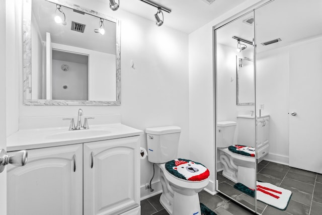 full bath with tile patterned flooring, visible vents, vanity, and toilet