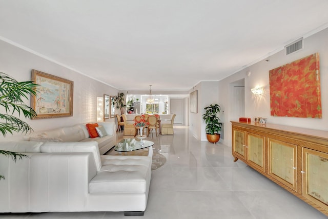 living room featuring ornamental molding and visible vents