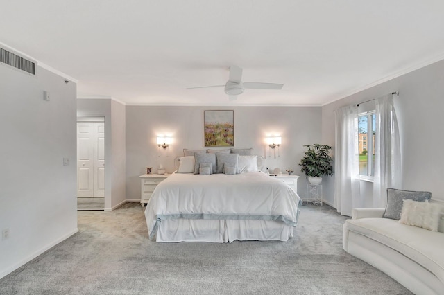 bedroom with light colored carpet, visible vents, ornamental molding, ceiling fan, and baseboards