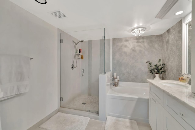 full bathroom featuring a bath, a stall shower, vanity, and visible vents