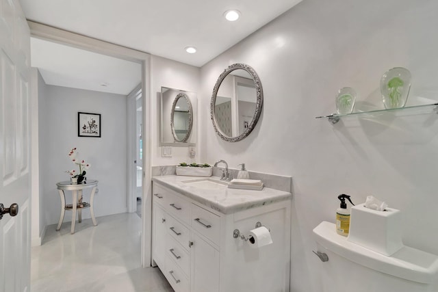 bathroom featuring toilet, recessed lighting, finished concrete flooring, and vanity