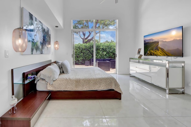 tiled bedroom featuring access to outside