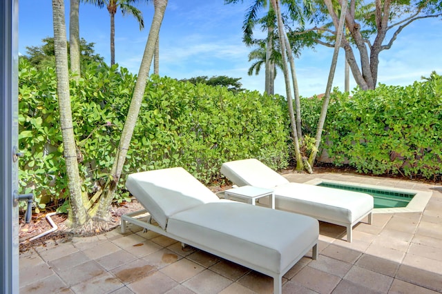 view of patio / terrace featuring fence