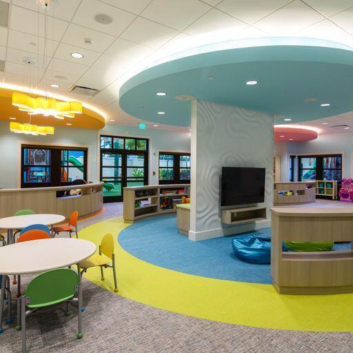 game room featuring carpet floors, french doors, a drop ceiling, and recessed lighting