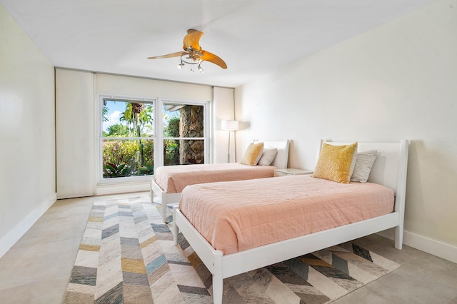 bedroom featuring a ceiling fan and baseboards