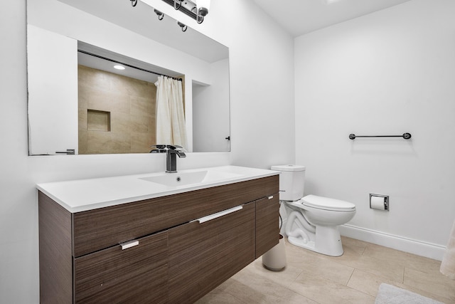 bathroom with tile patterned flooring, baseboards, toilet, a shower with shower curtain, and vanity