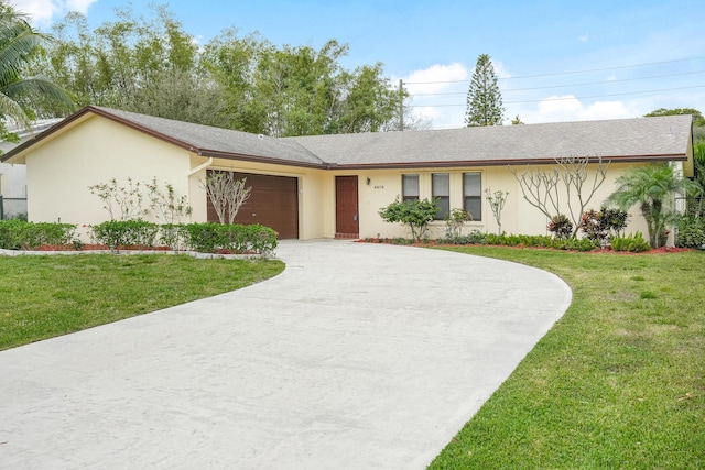 ranch-style home featuring an attached garage, concrete driveway, a front yard, and stucco siding