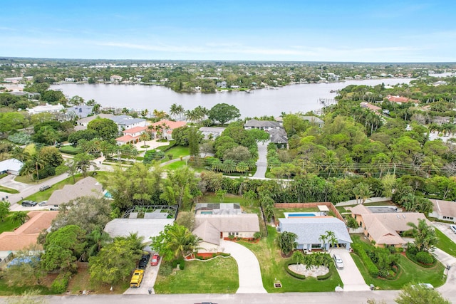 birds eye view of property featuring a residential view and a water view