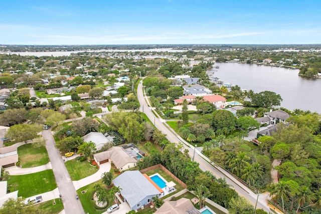 bird's eye view featuring a water view and a residential view