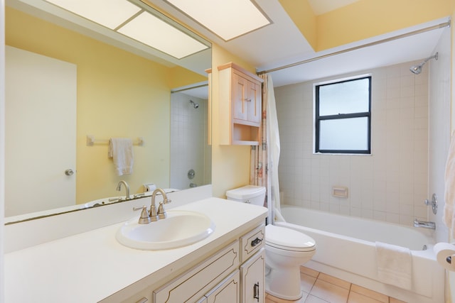 bathroom featuring vanity, shower / bath combination with curtain, tile patterned flooring, and toilet