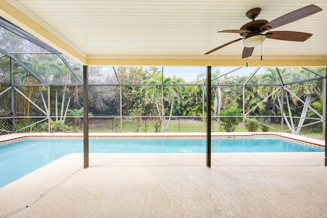 pool featuring a lanai, ceiling fan, and a patio