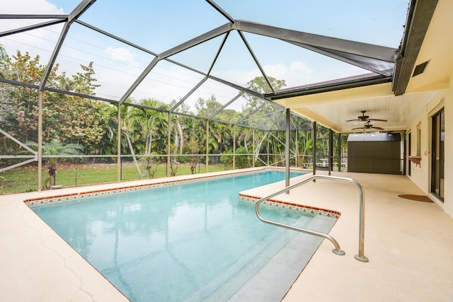 pool featuring a lanai, a patio area, and ceiling fan