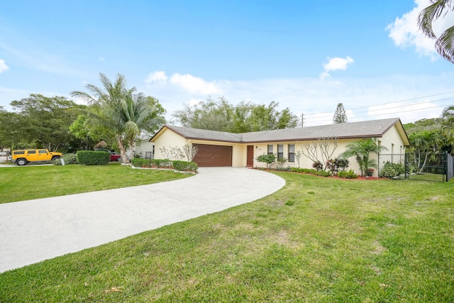 ranch-style home featuring stucco siding, concrete driveway, an attached garage, a front yard, and fence