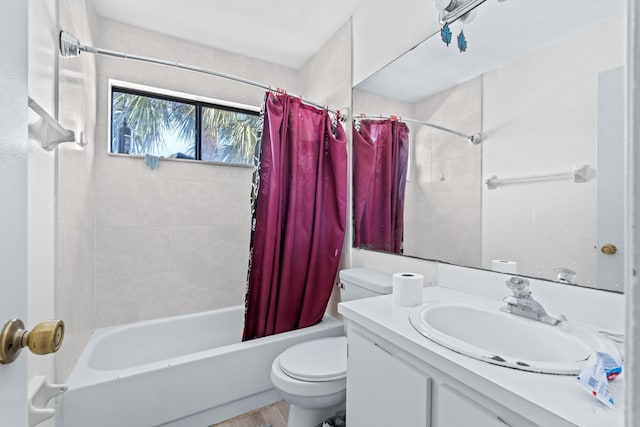 full bath featuring toilet, shower / tub combo, and vanity