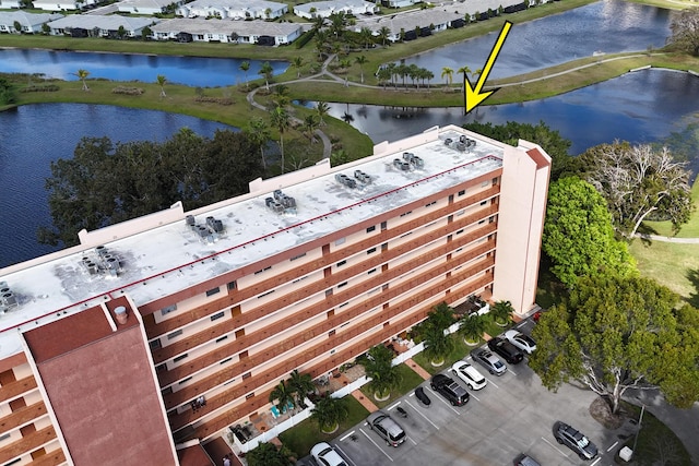 birds eye view of property featuring a water view